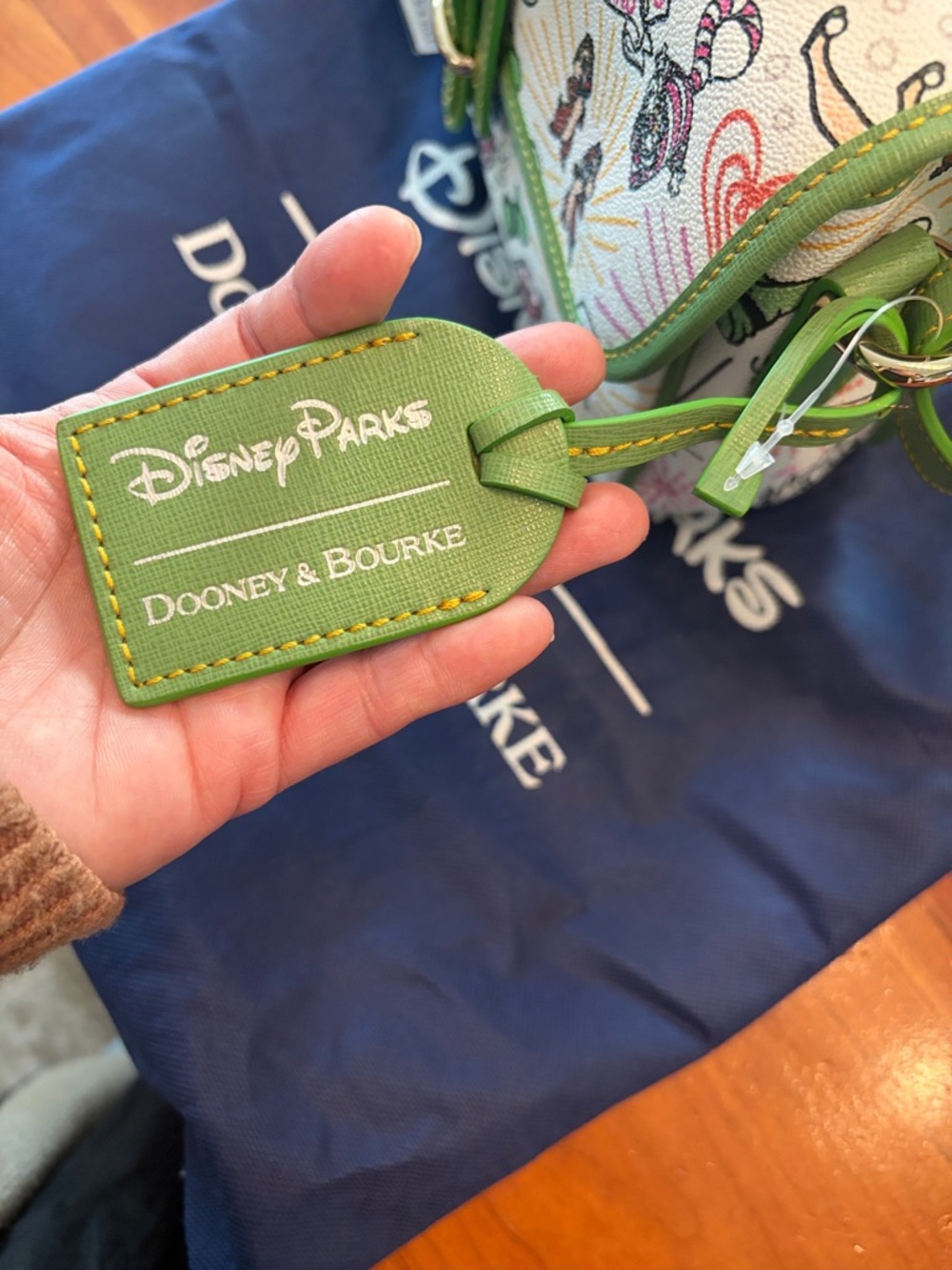 Dooney & Bourke White Multicolor Disney Character Shoulder Bag with Green Trim - Picture 14 of 16